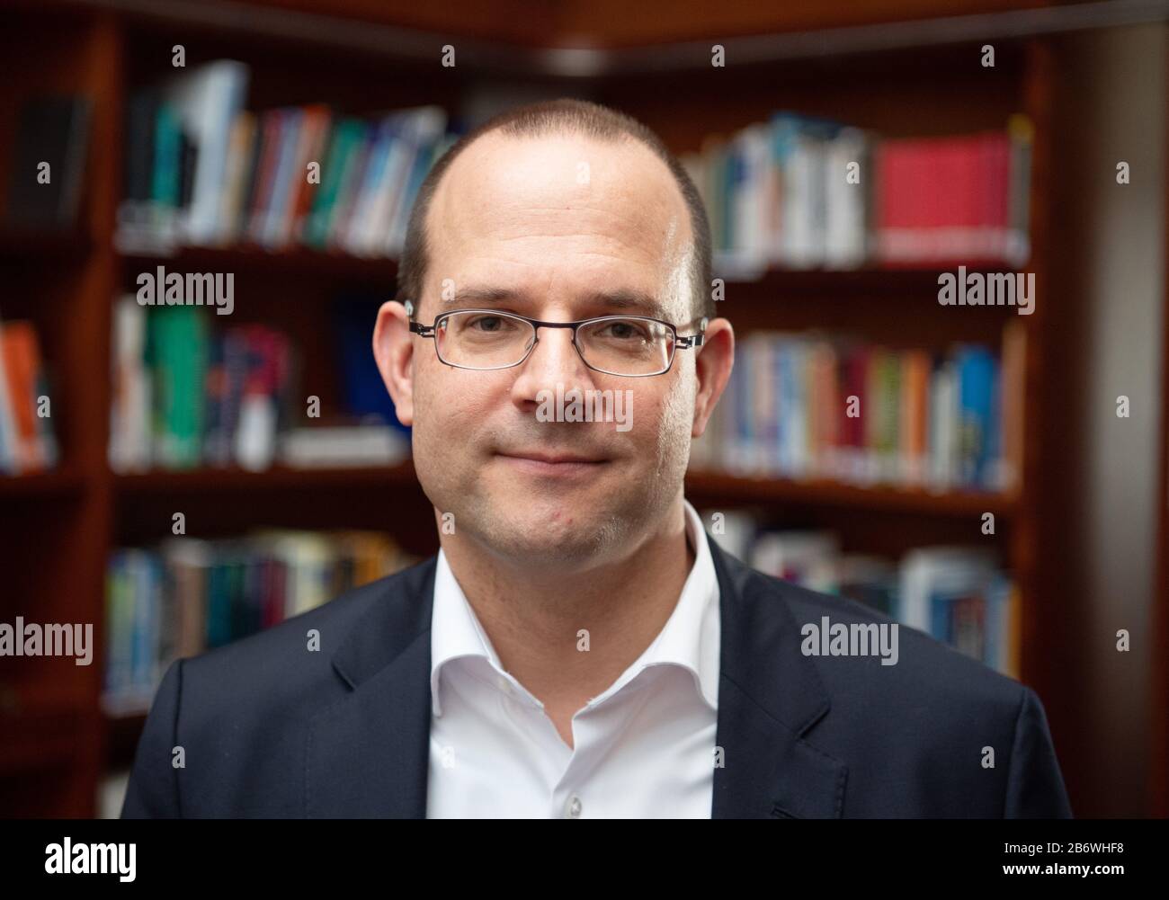 Potsdam, Germany. 11th Mar, 2020. Tobias Dünow, Brandenburg State Secretary for Science, Research and Culture, is standing in the library of the Fraunhofer Institute for Cell Therapy and Immunology. Credit: Soeren Stache/dpa-Zentralbild/ZB/dpa/Alamy Live News Stock Photo