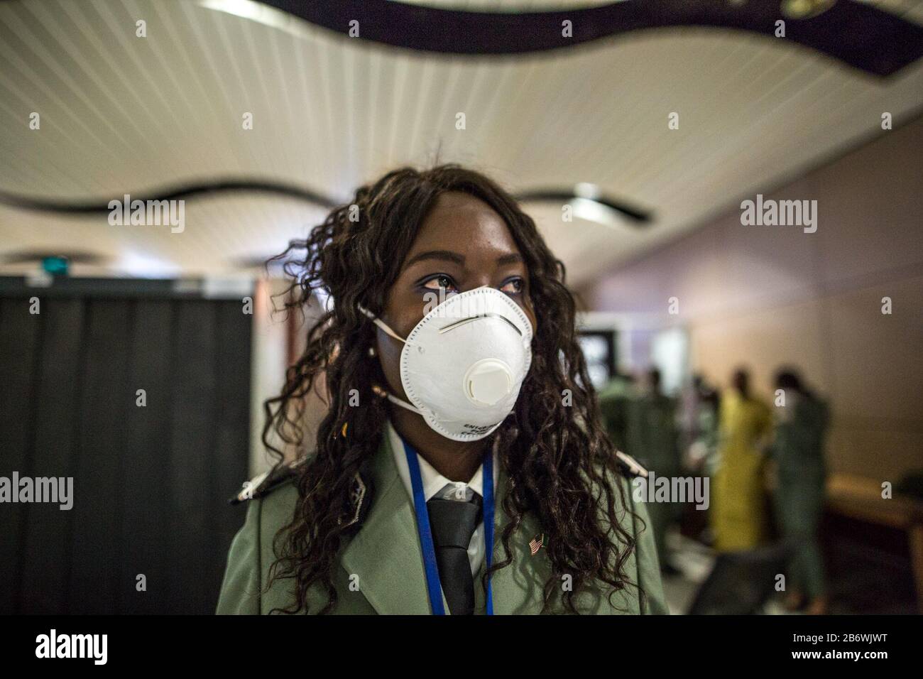 Dakar. 10th Mar, 2020. Photo taken on March 10, 2020 shows a Senegalese customs officer wearing face mask while working in Dakar, Senegal. Senegalese Ministry of Health and Social Action confirmed the country's fifth case of the COVID-19 on Wednesday. In order to prevent more cases from entering Senegal, the authorities of Blaise Diagne International Airport, under the guideline of Senegalese Ministry of Health and Social Action, have intensified all the necessary measures to detect cases of the novel coronavirus. Credit: Eddy Peters/Xinhua/Alamy Live News Stock Photo