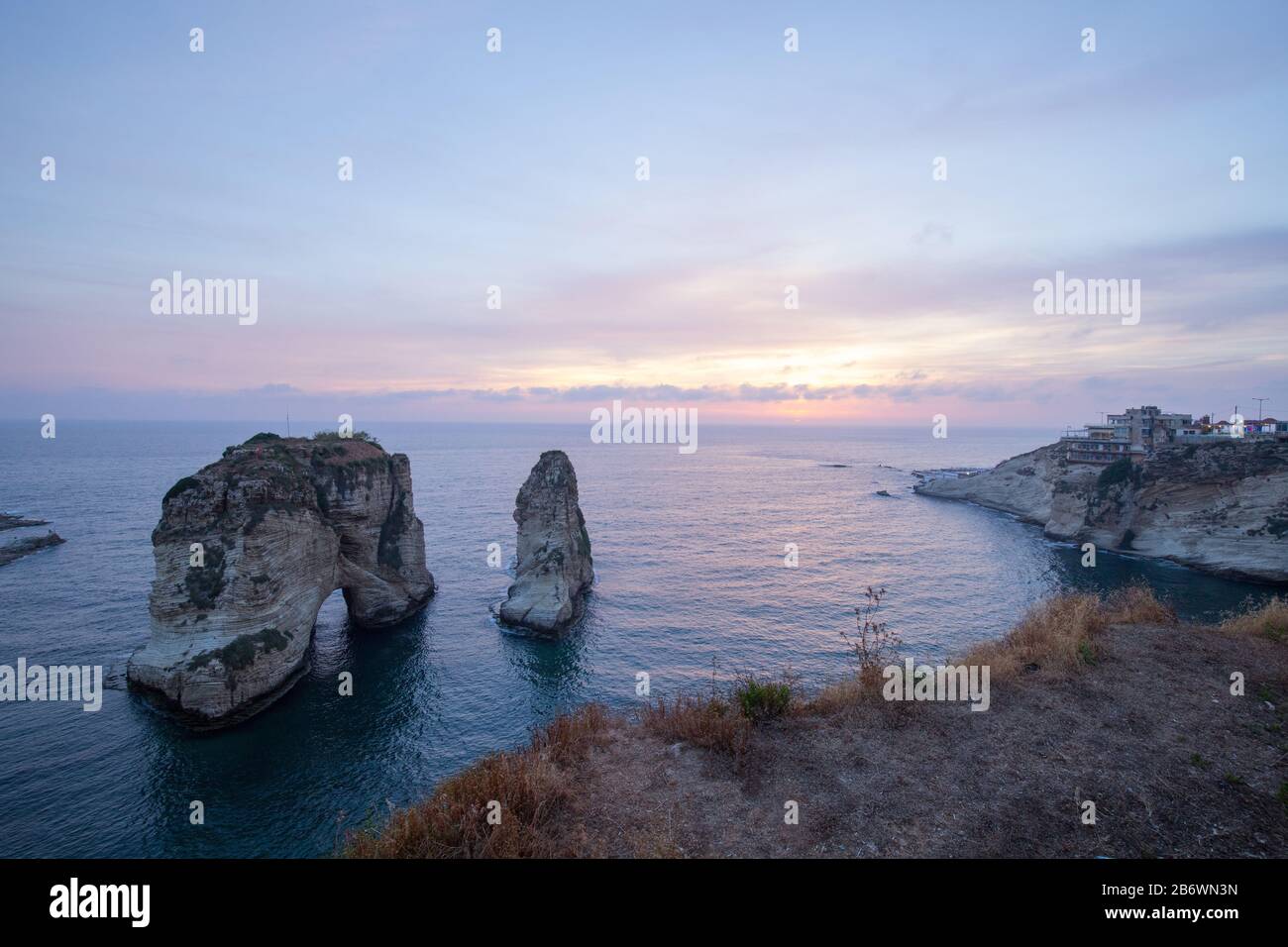 Sunset view of Pigeon Rock (Raouche), Beirut. Lebanon - June, 2019 Stock Photo