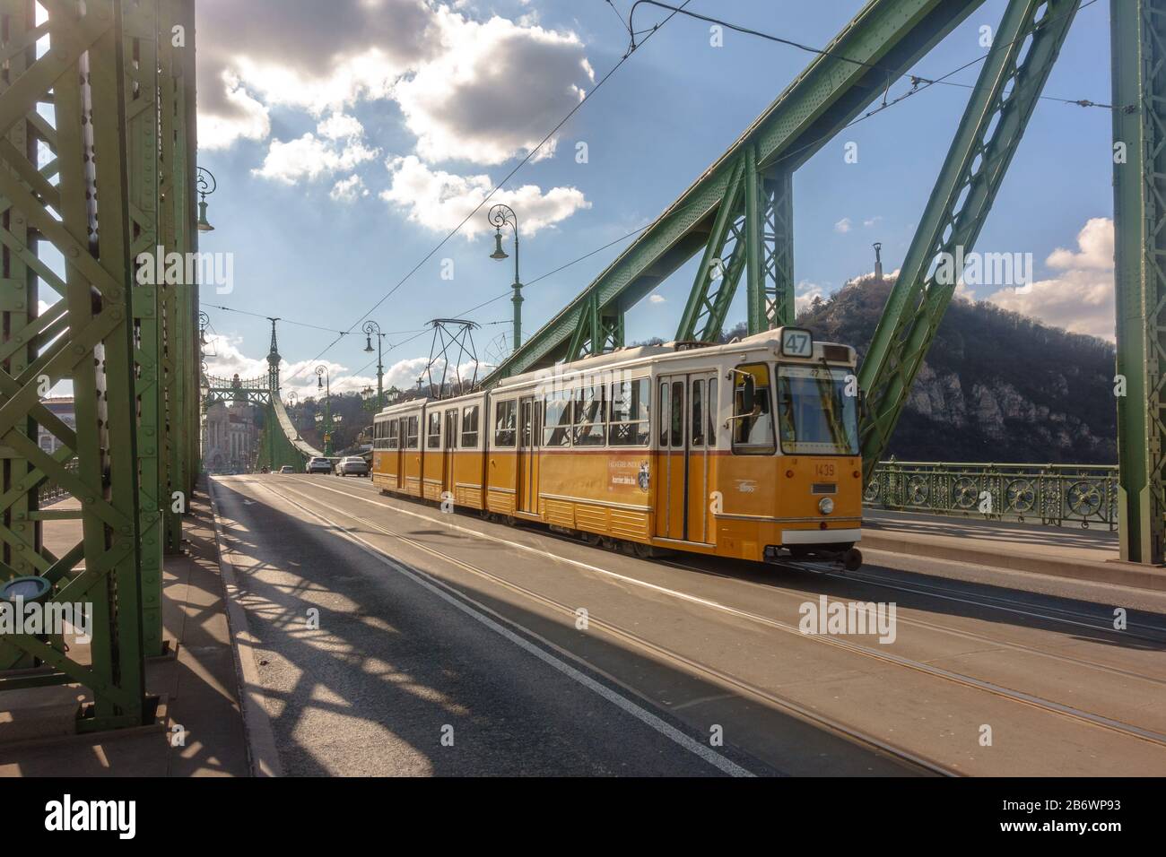 A Ganz CSMG tram on line 47 crossing the Liberty Bridge in Budapest, Hungary Stock Photo