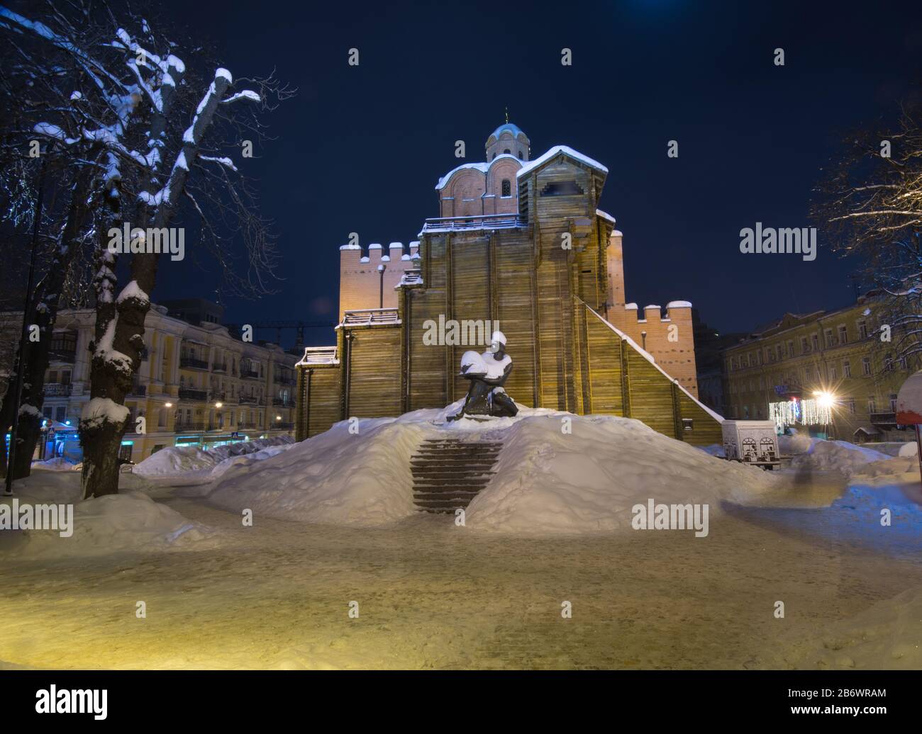 Illuminated Golden Gates and Yaroslav the Wise monument (Kiev). Winter