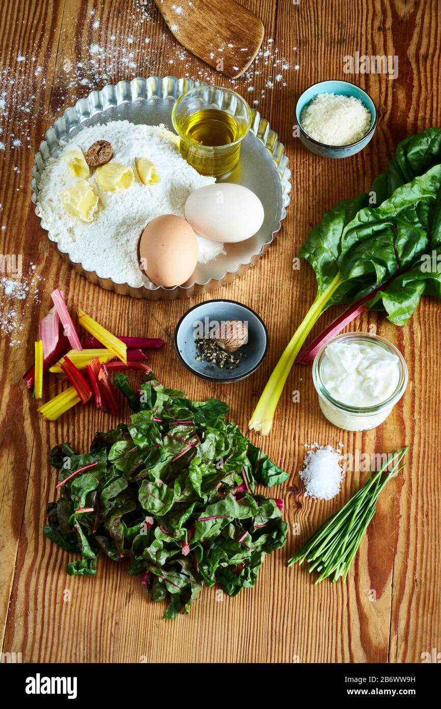 Children investigating food. Ingredients for chard quiche. Learning according to the Reggio Pedagogy principle, playful understanding and discovery. Germany. Stock Photo