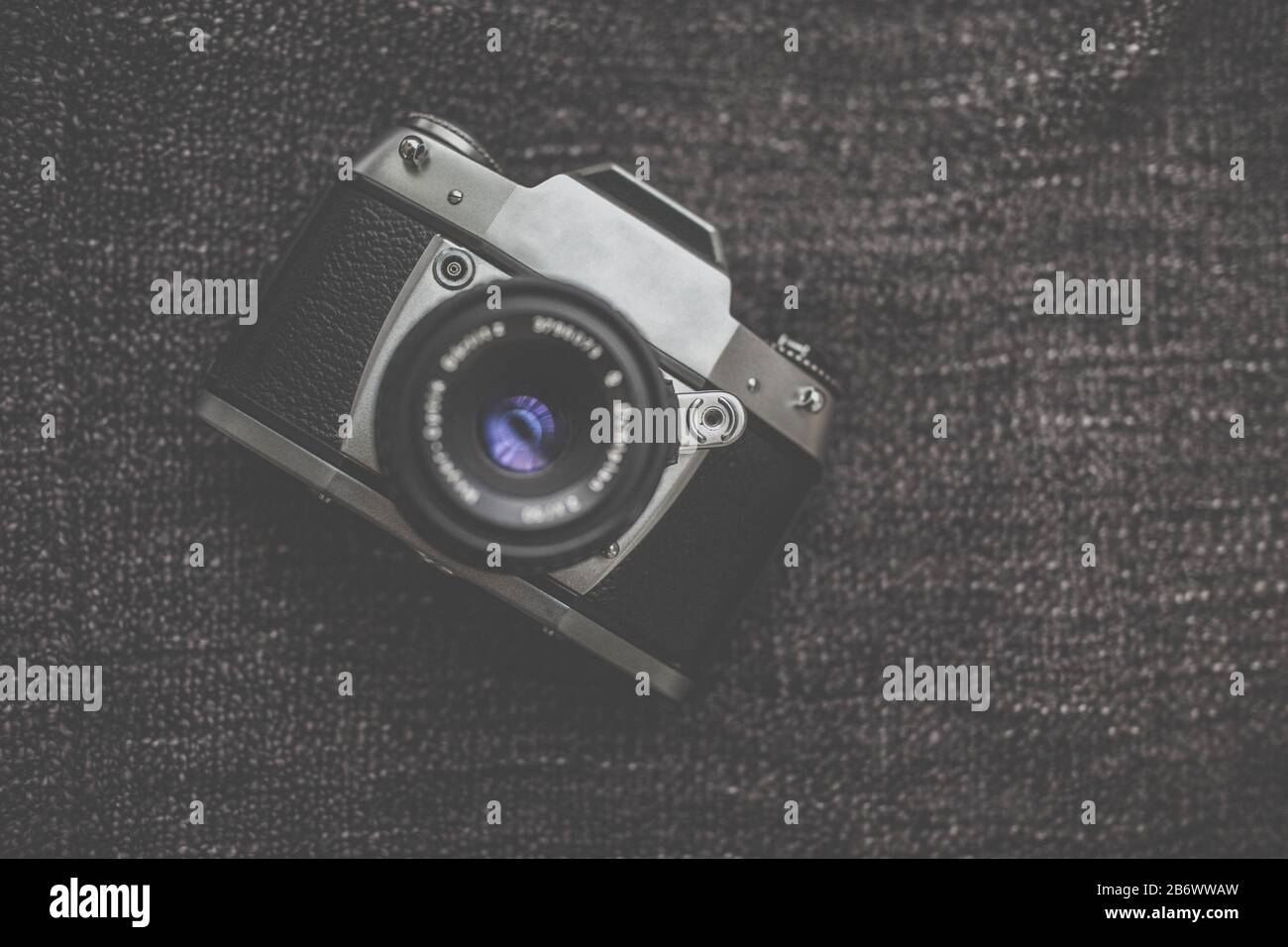 Old Retro Camera On Vintage Wooden Boards Abstract Background With