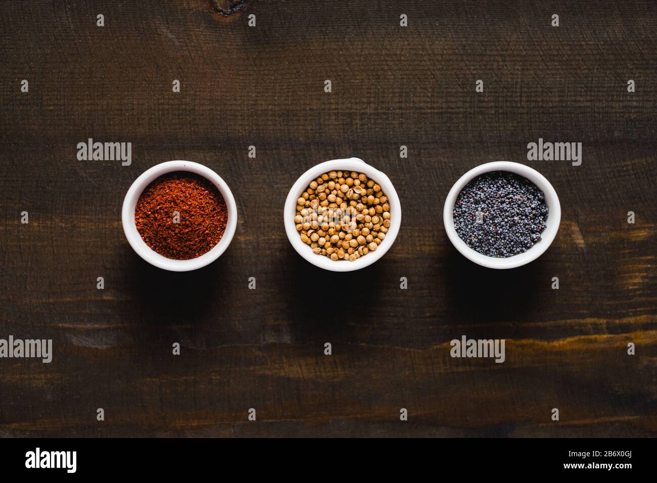 Different kind of spices on dark background. Stock Photo