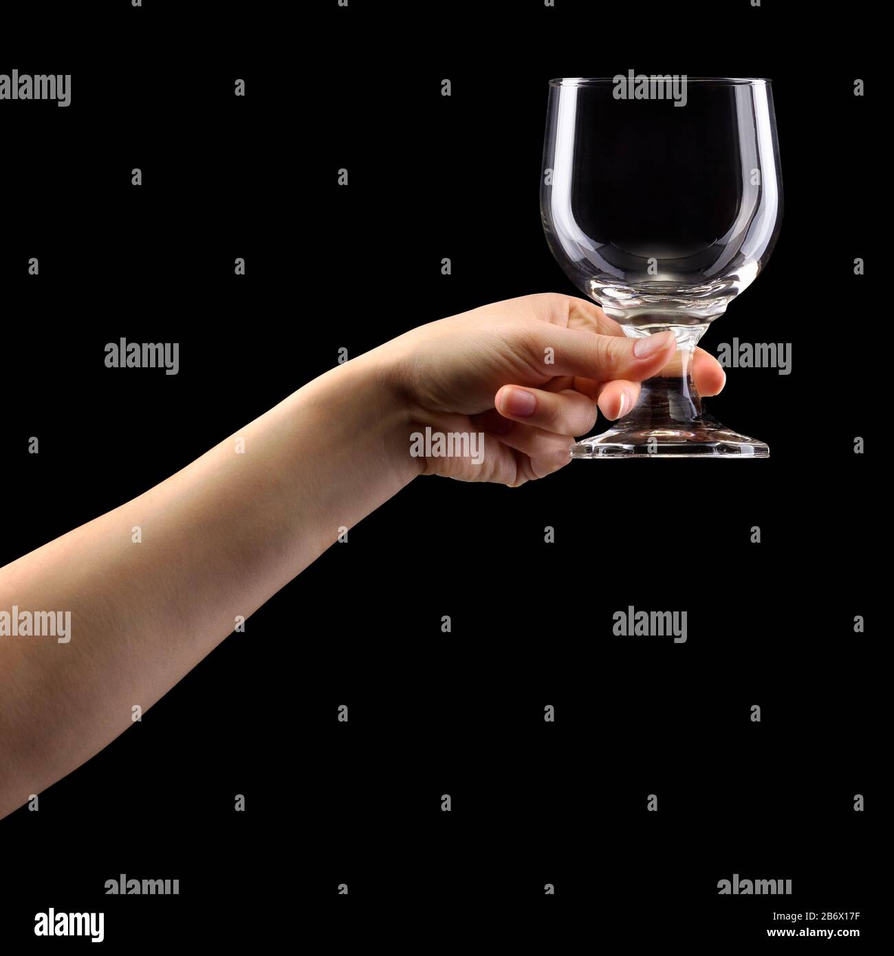 https://c8.alamy.com/comp/2B6X17F/woman-hand-holding-empty-beer-glass-isolated-on-black-2B6X17F.jpg
