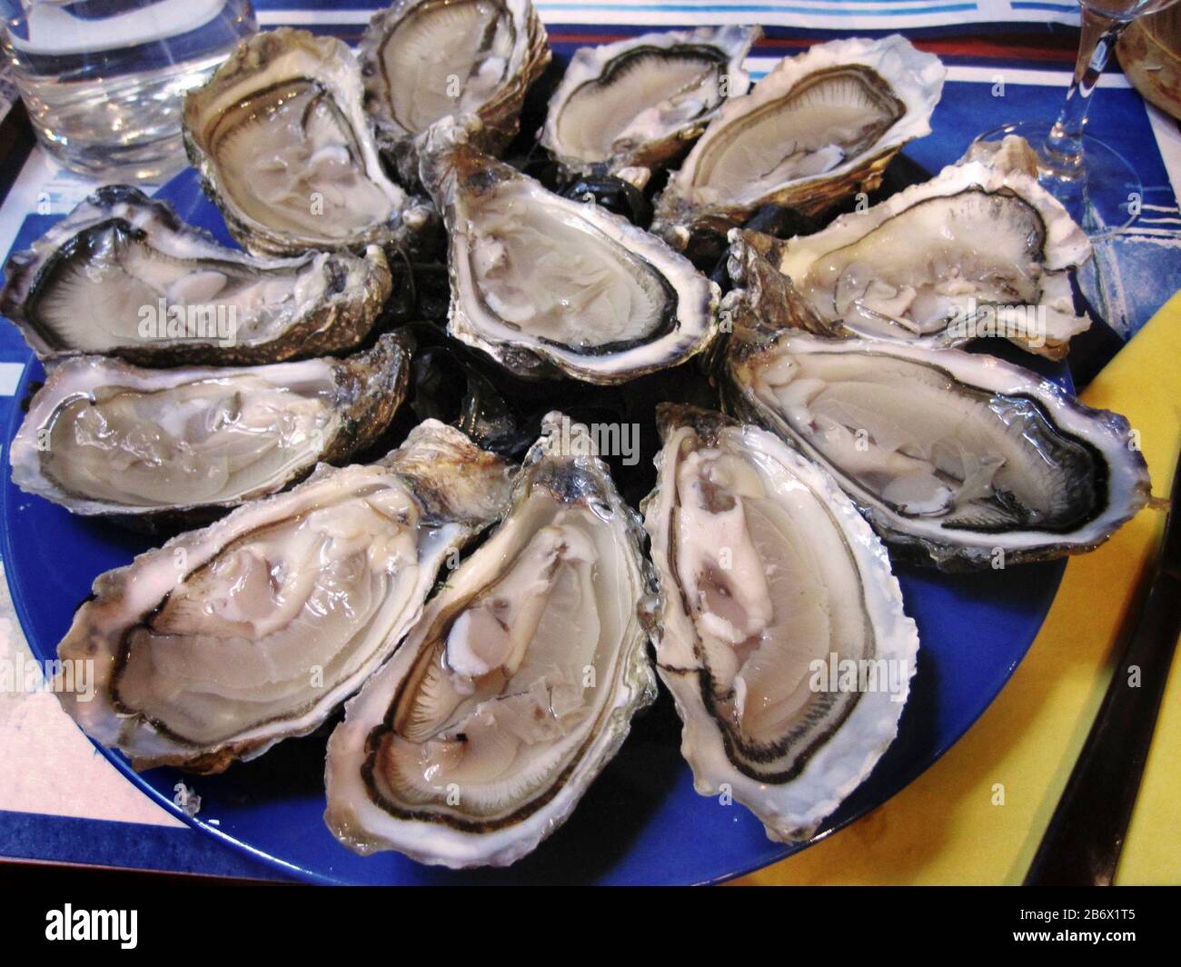 Cancale, The Oyster Capital of Brittany, France, provides the French with this very delectable seafood. Stock Photo