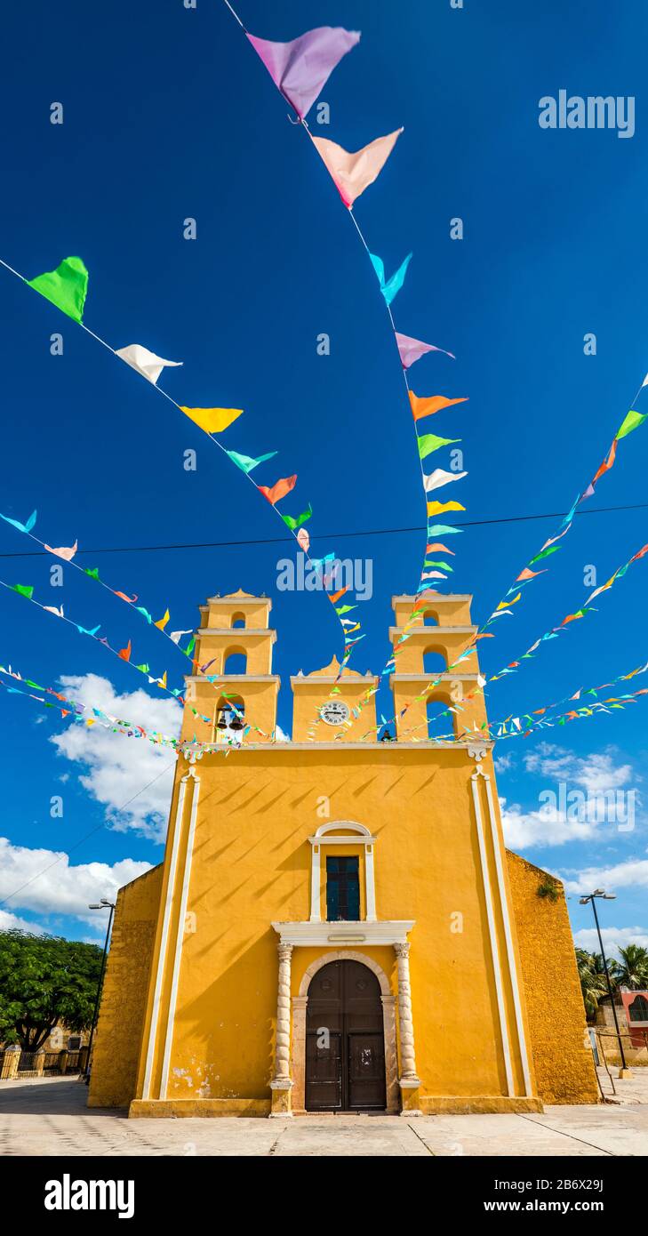 Iglesia de Nuestra Senora de la Natividad, decorated with pennants, in Acanceh, Yucatan state, Mexico Stock Photo