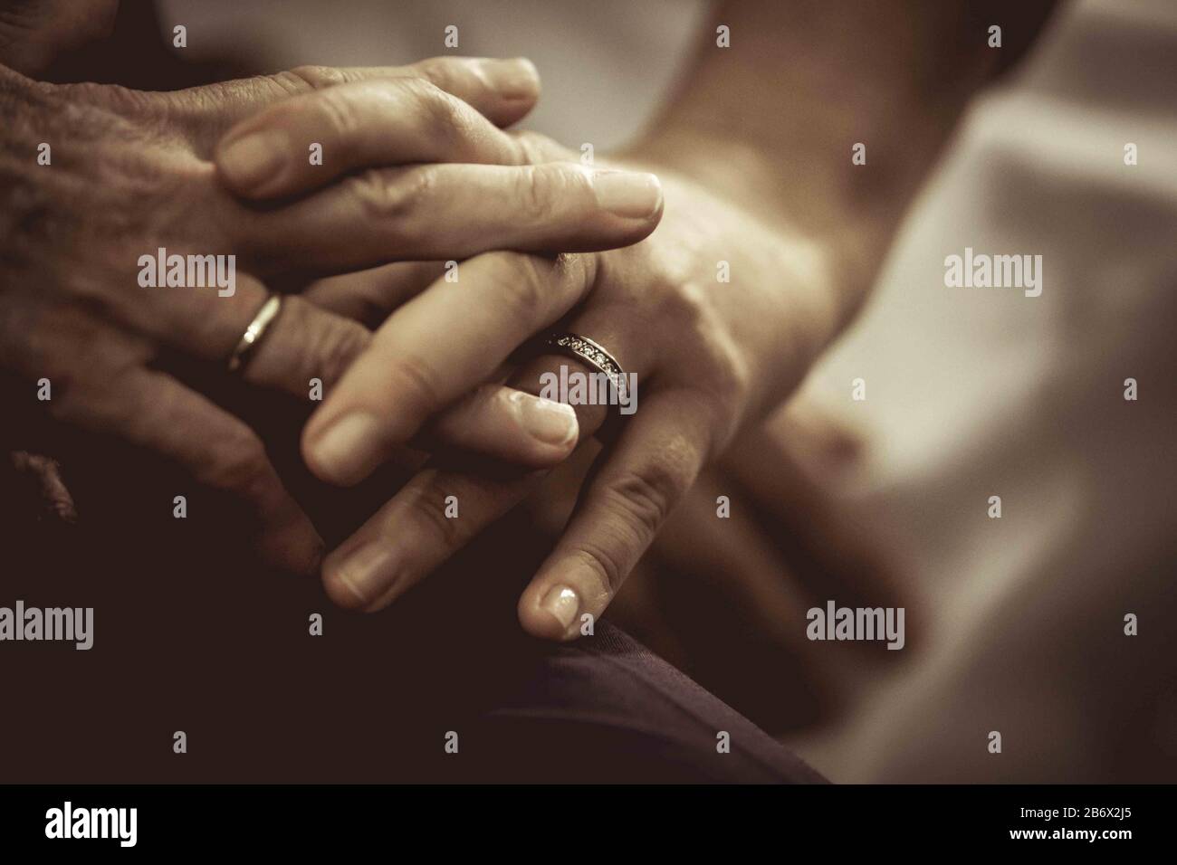 fingers crossed of groom and bride during the wedding Stock Photo