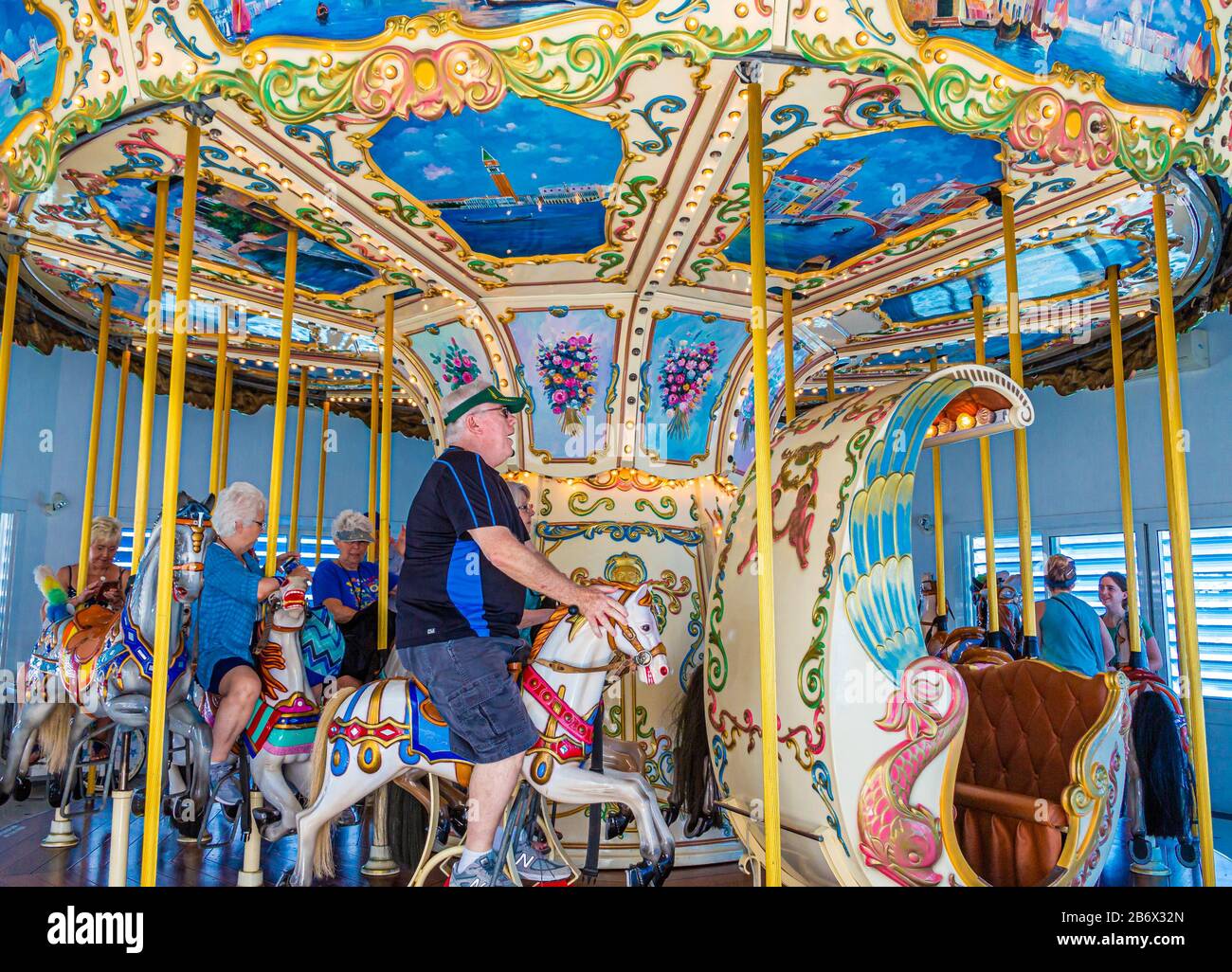 Elderly People Enjoying a Ride on a Merry Go Round on St Martin