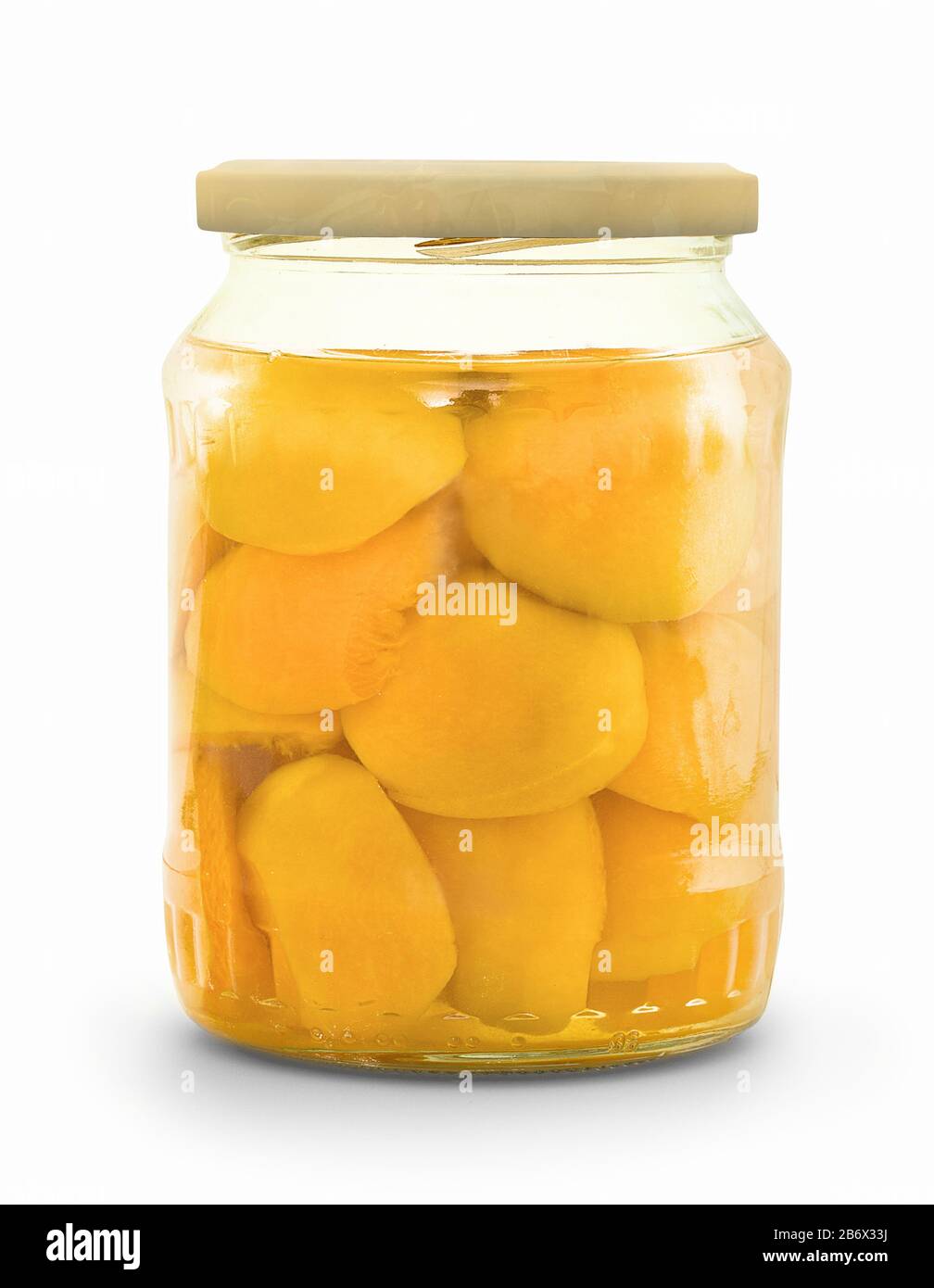 Sealed apricots in a glass cup. Apricot compote. Canned aricots in glass Jar. Preserved fruit in glass. Stewed apricots. Stock Photo