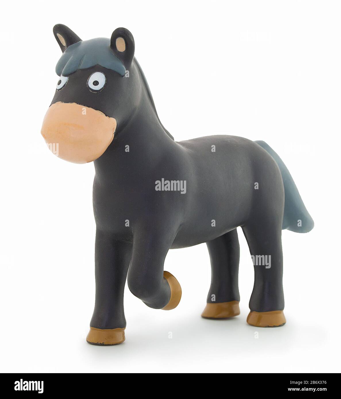 Plastic horse toy, isolated on white background with natural shadow. Black horse plaything with short tail and mane.  Isolated on white bg. Gee-gee to Stock Photo