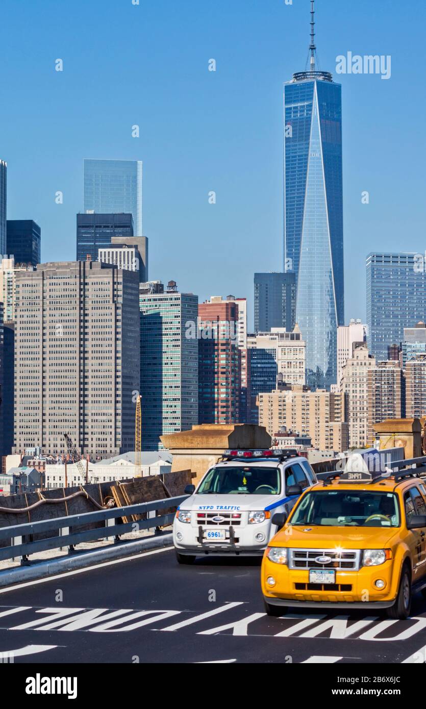 Street scene with skyscrapers. The tall building is One World Trade Center, also known as 1 World Trade Center, 1 WTC or Freedom Tower.  New York, New Stock Photo