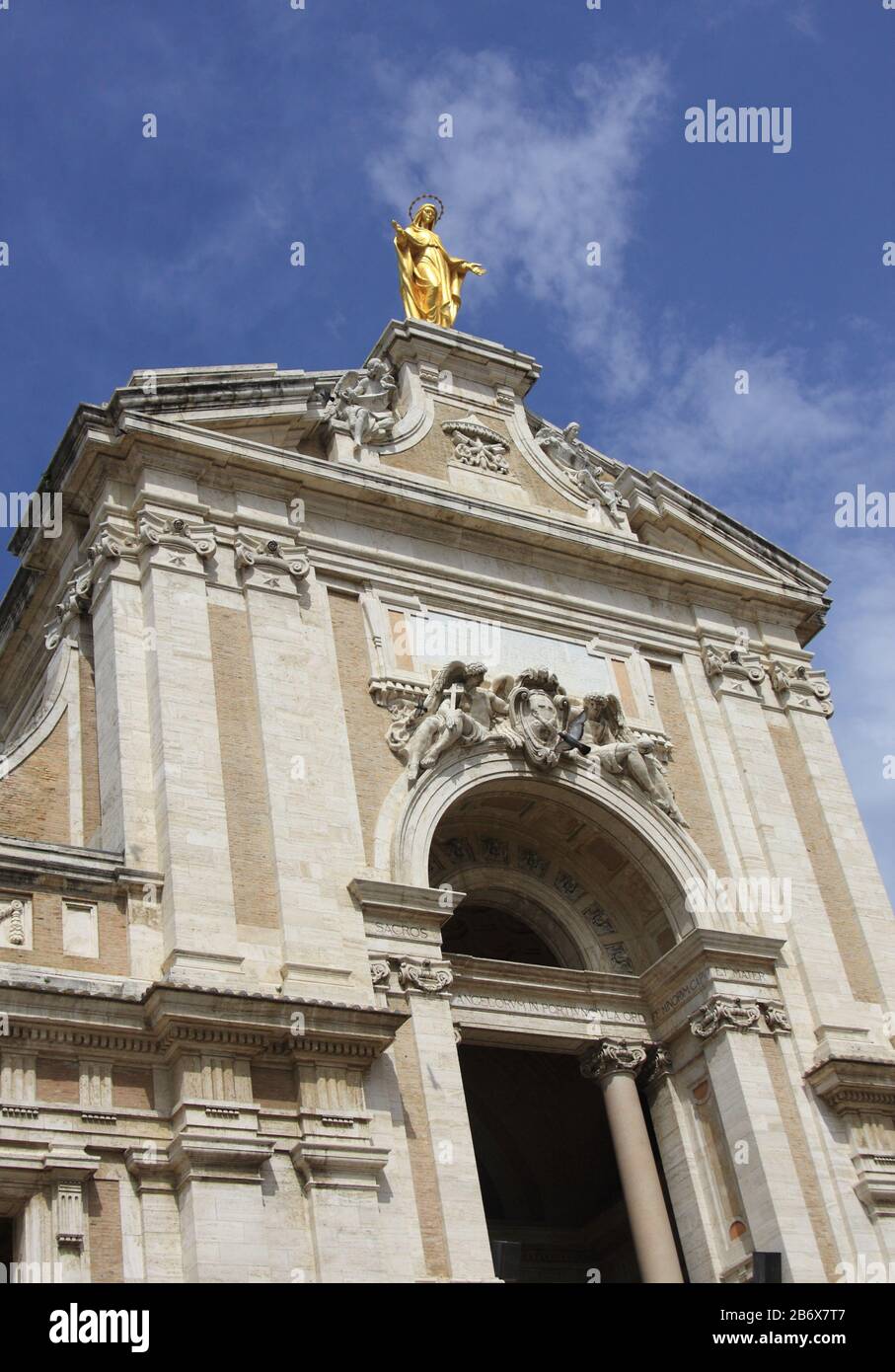 Facade of 16th century Basilica of Santa Maria degli Angeli, Church of St Mary of the Angels, with the statue of Saint Mary, Assisi, Umbria, Italy Stock Photo