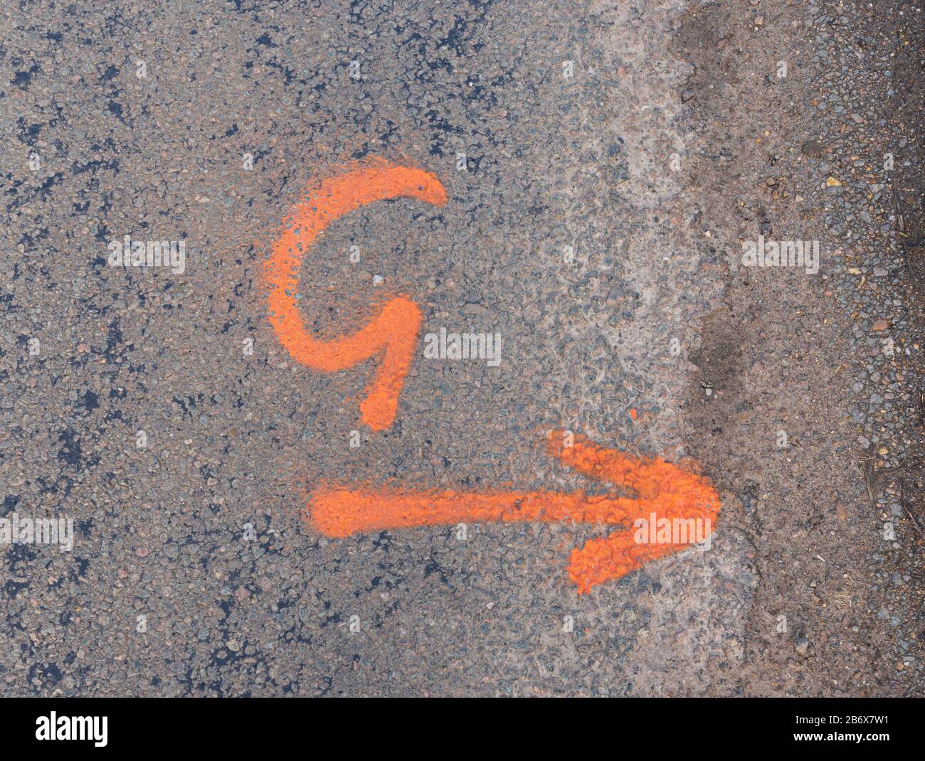 Spray painted markings left on road by contractors for future roadworks. Much Hadham, Hertfordshire. UK Stock Photo