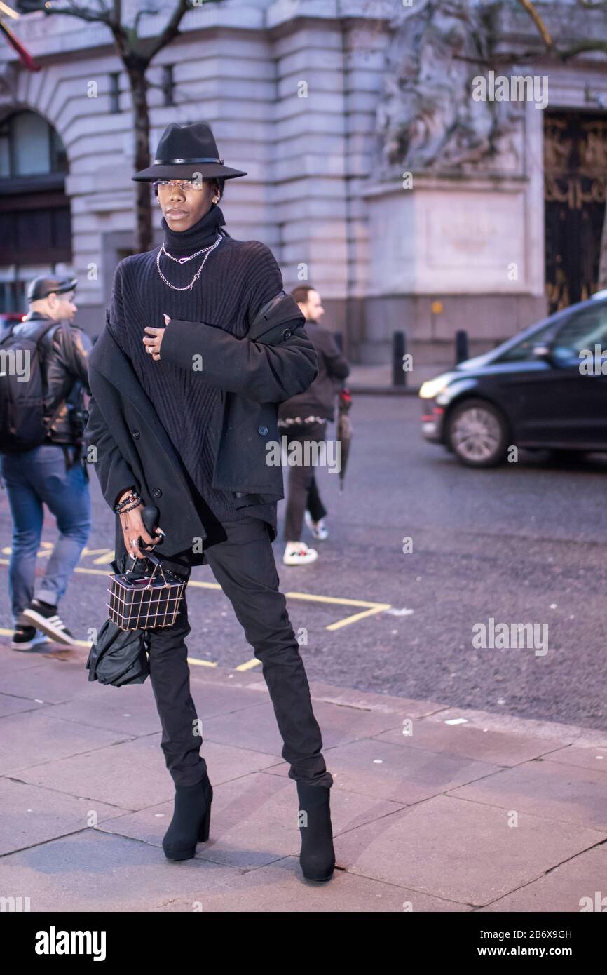 LONDON, UK- febryary 15 2020: Fashionable people on the street . Street  style. A man in a black turtleneck and jeans and a high hat. Michael  Jackson's Stock Photo - Alamy