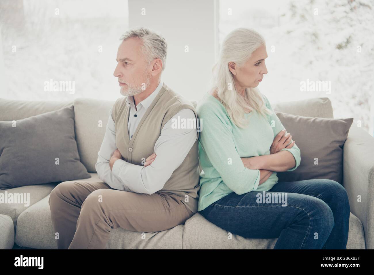 Side profile photo of two sad upset calm proud relatives dot not want to understand each other Stock Photo