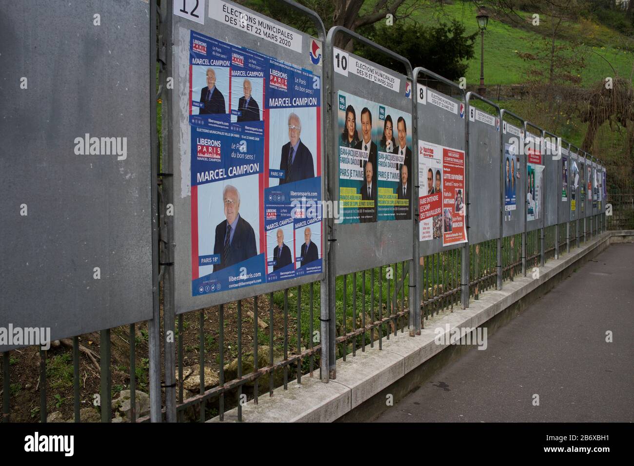Official display panels showing electoral candidates of French municipal elections, amid Coronavirus concerns, rue Ronsard, Montmartre, 75018 Paris, France, March 2020 Stock Photo