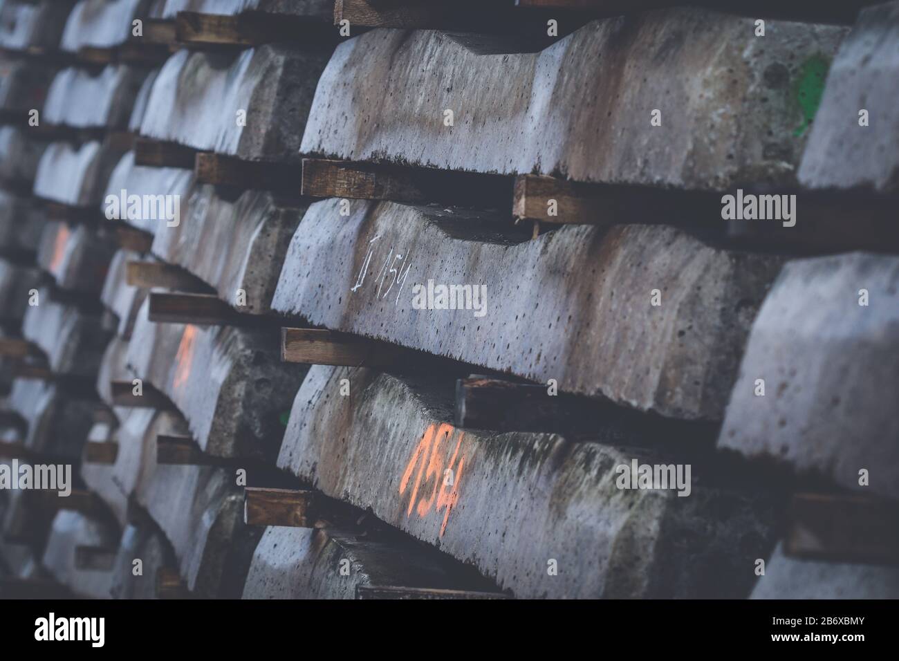 New concrete railway sleepers stacked up in a rows ready to lie under railway track Stock Photo
