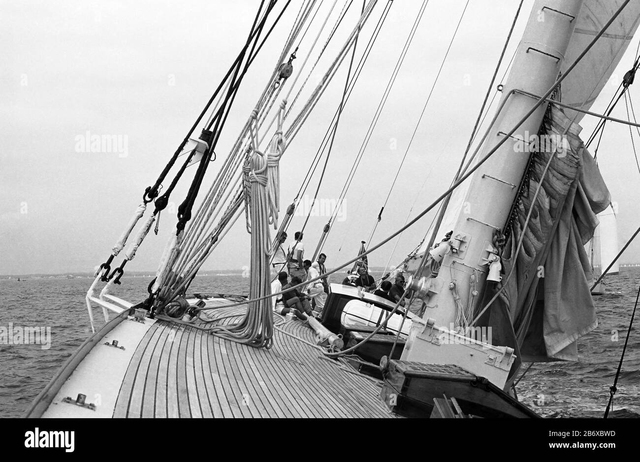 Looking aft aboard J Class yacht 'Velsheda' (K7), close-hauled in a light breeze: sailing in the Solent after first refit, summer 1991.  Archive black and white film photograph Stock Photo