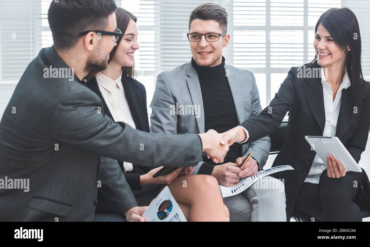 business colleagues greet each other at an office meeting Stock Photo