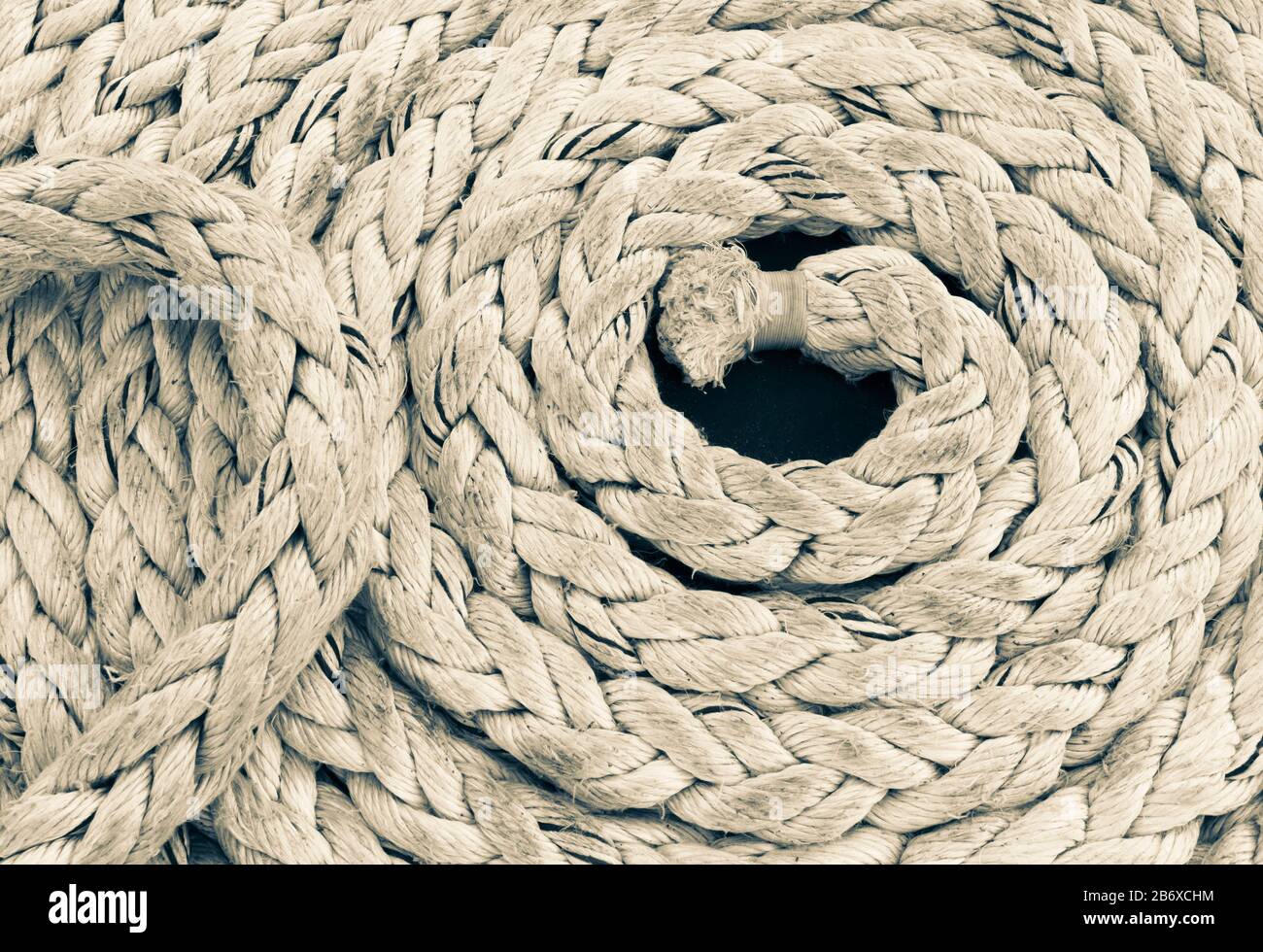 Coil of plaited rope on sailing boat deck Stock Photo