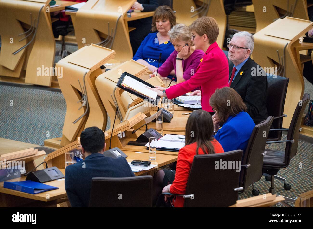 Edinburgh, UK. 12th Mar, 2020. Pictured: Nicola Sturgeon MSP - First Minister of Scotland and Leader of the Scottish National Party (SNP). Scenes from First Ministers Questions at the Scottish Parliament on the first week of the trial of Former First Minister - Alex Salmond, and tensions aa running high at Holyrood. Credit: Colin Fisher/Alamy Live News Stock Photo