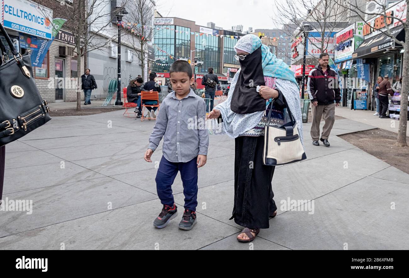 A Muslim grandmother touches and talks to her grandson in Diversity