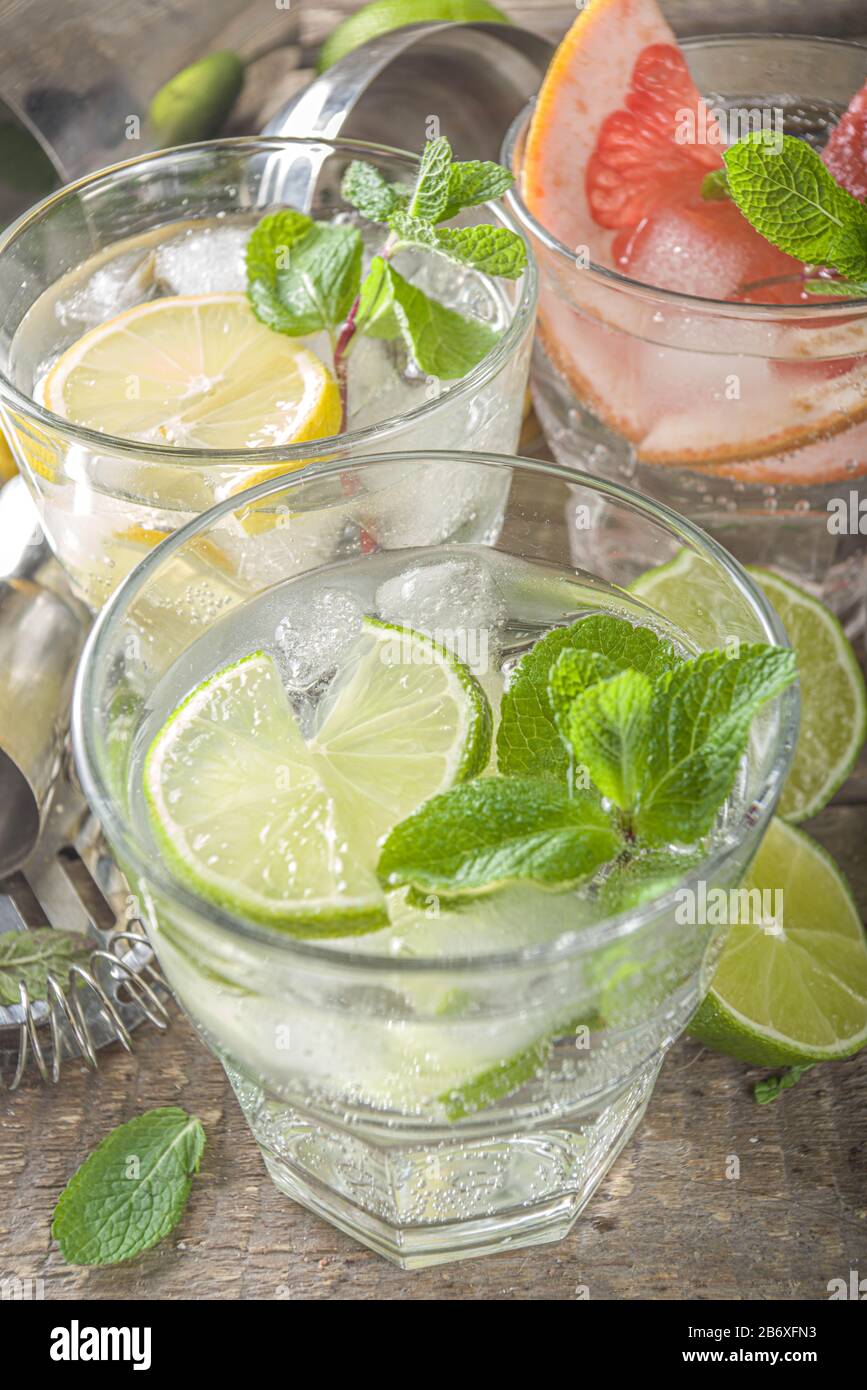 Summer detox beverage concept. Citrus fruit drinks with ice. Healthy