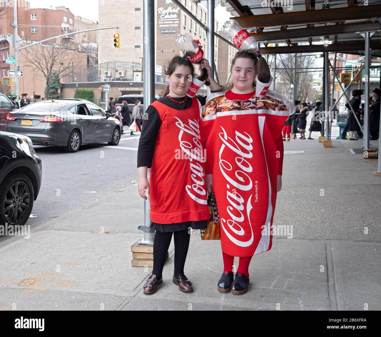 2 orthodox Jewish teenagers dress as large cups of Coca Cola for the Purim  holiday. In Williamsburg, Brooklyn, New York City Stock Photo - Alamy