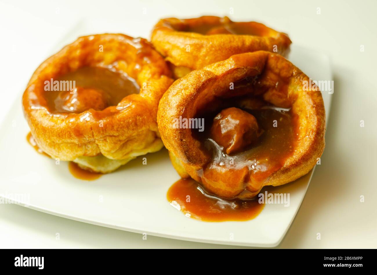 Traditional English Yorkshire pudding with meatballs and thick gravy sauce, english food Stock