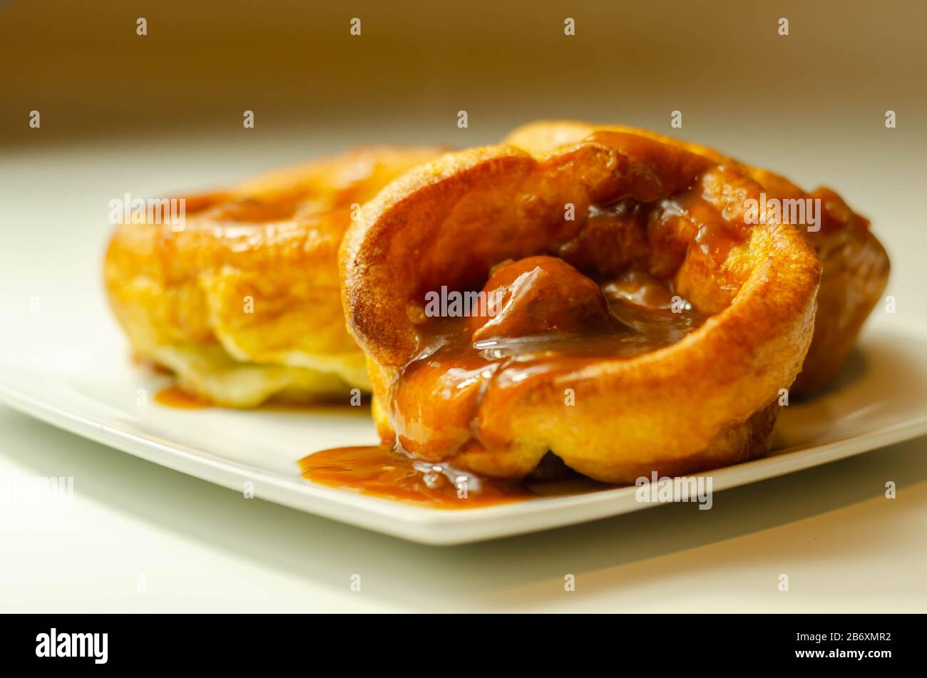 Traditional English Yorkshire pudding with meatballs and thick gravy