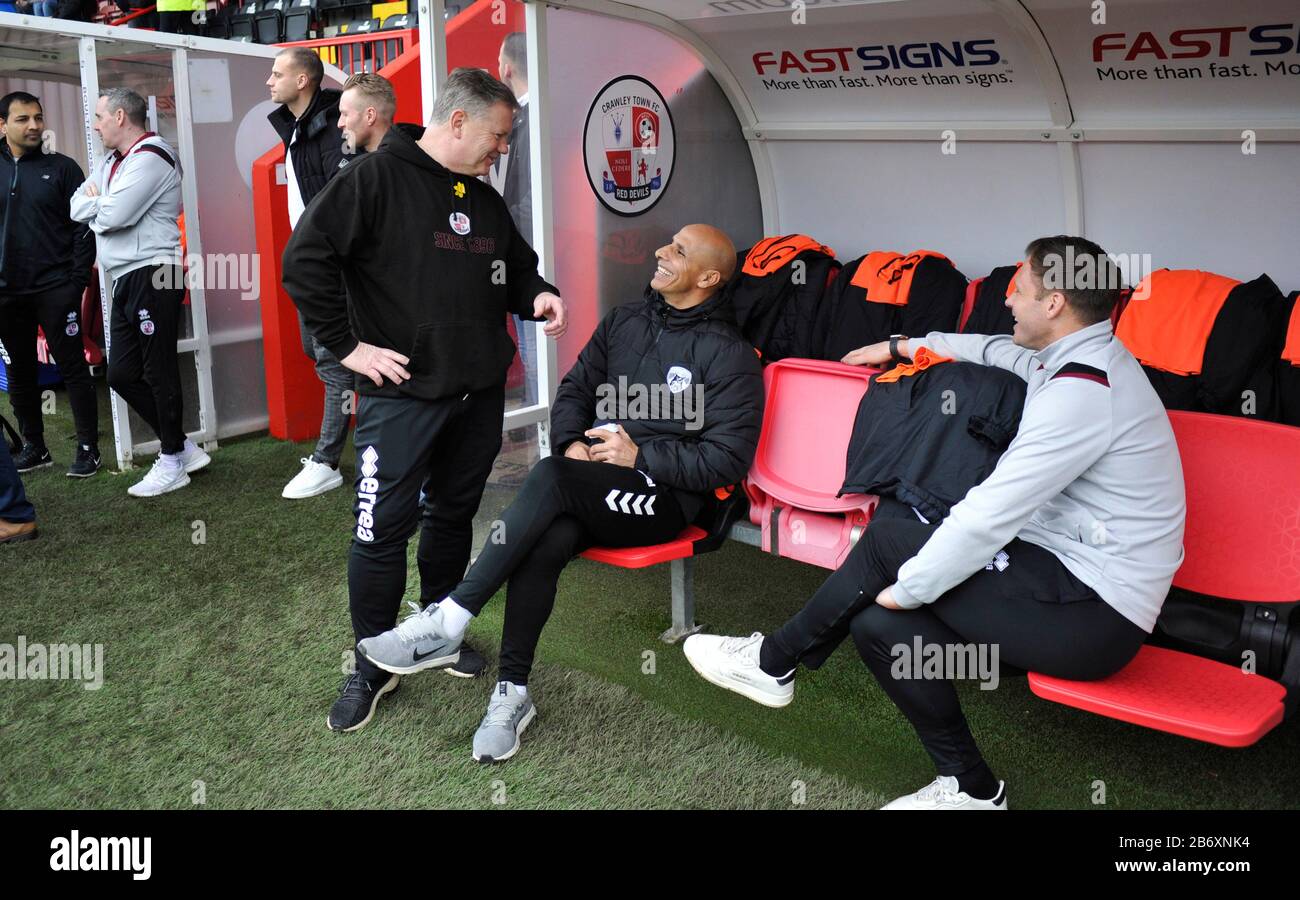 Oldham head coach Dino Maamria (seated in the centre) chats to Crawley manager John Yems (left) and Dannie Bulman of Crawley before  the League Two match between Crawley Town and Oldham Athletic at The People's Pension Stadium , Crawley , UK - 7th March 2020 - Editorial use only. No merchandising. For Football images FA and Premier League restrictions apply inc. no internet/mobile usage without FAPL license - for details contact Football Dataco Stock Photo