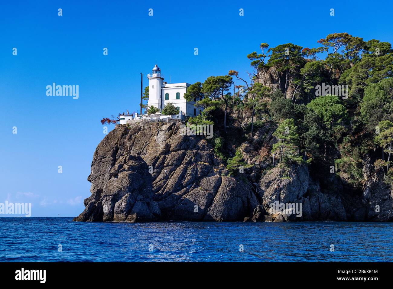 Lighthouse guiding ships into Portofino harbor. Stock Photo