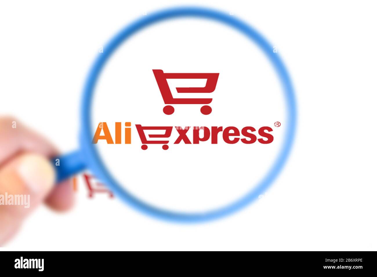 Benon, France - November 20, 2019:Aliexpress logo enlarged with magnifying glass. Aliexpress is an online commerce site of the China Alibaba Group spe Stock Photo