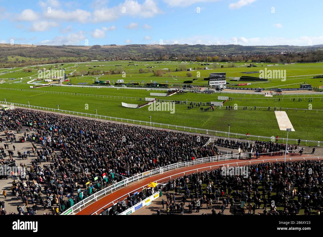 Runners and riders compete in the Marsh Novices Chase during day three of the Cheltenham Festival at Cheltenham Racecourse. Stock Photo
