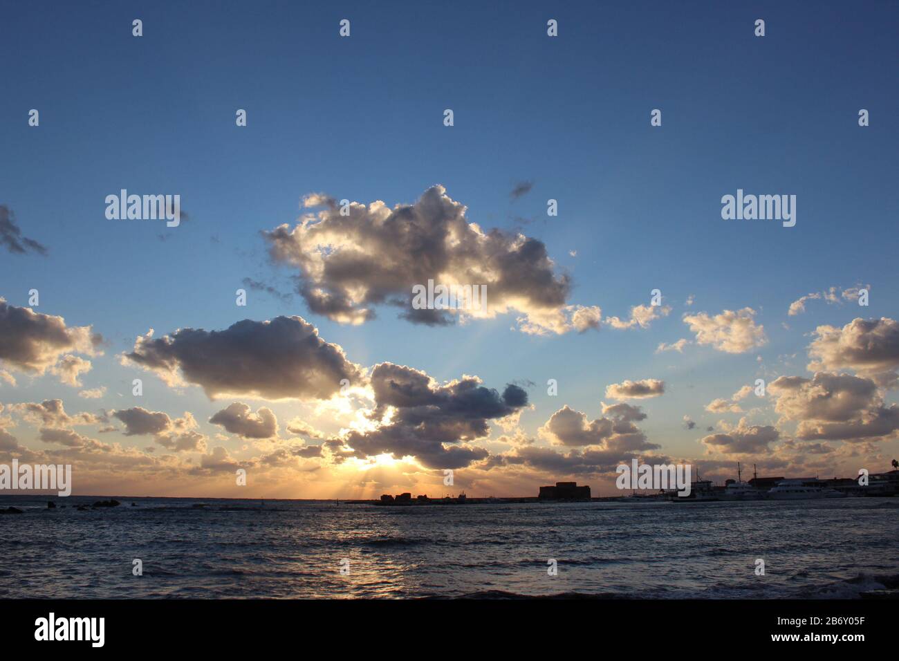 Sun Is Breaking Through The Clouds Beautiful Mediterranean Sea Sunset Colorful View Coast Horizon Evening Wallpaper Stock Photo