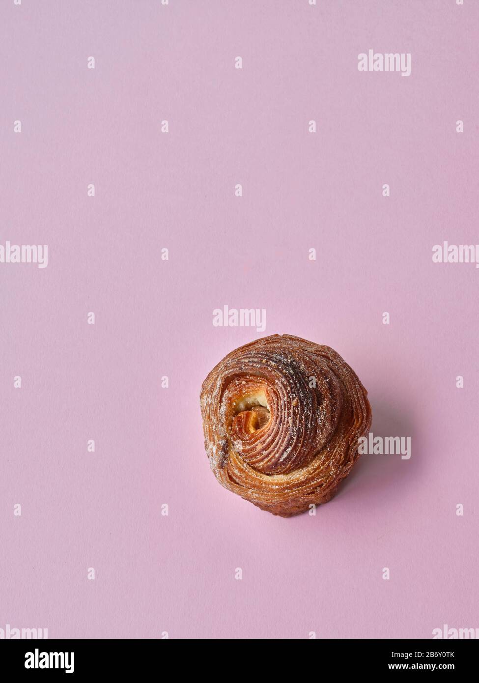 Da Bara Bakery cinnamon buns against a pink background Stock Photo