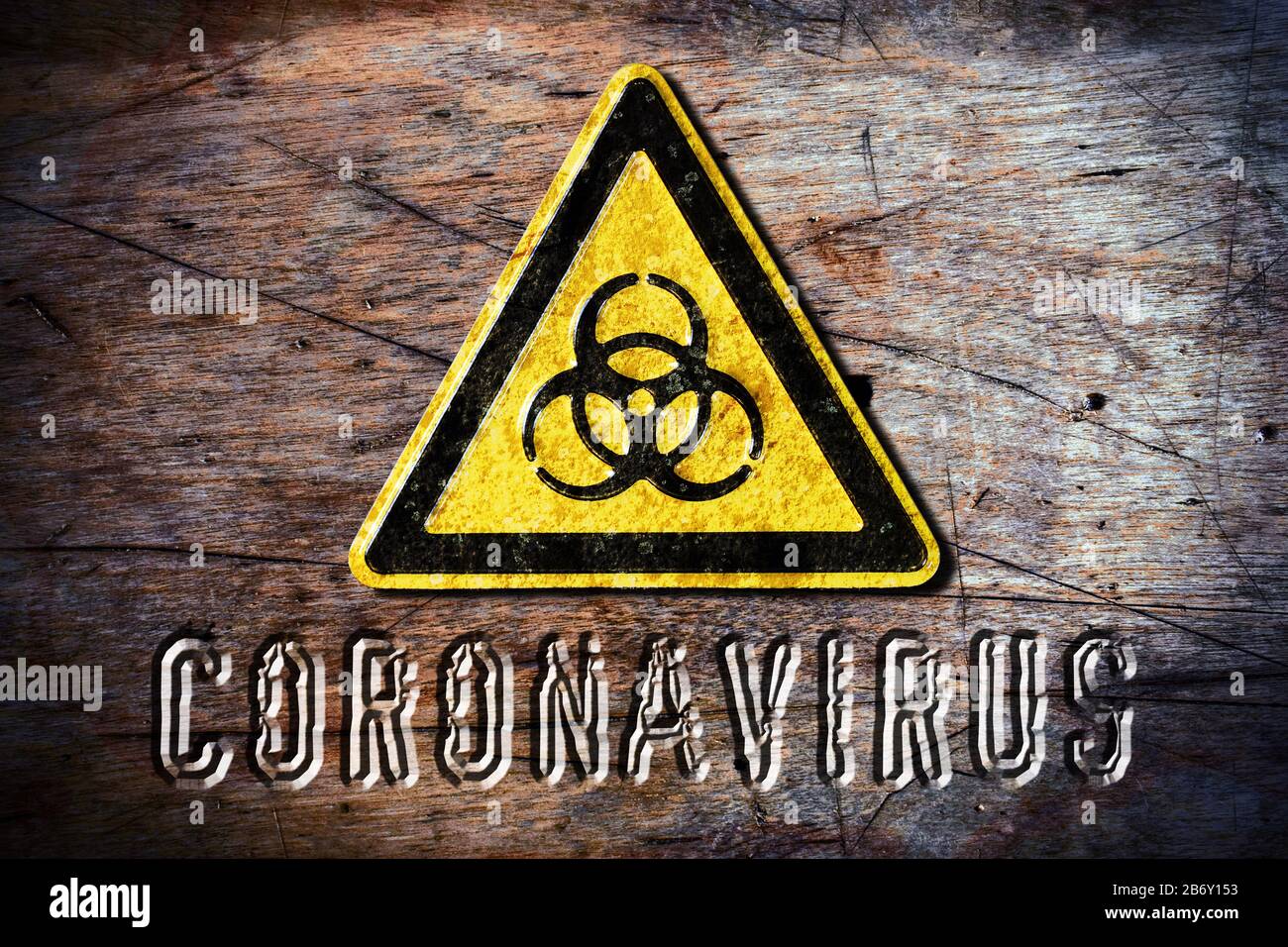 FOTOMONTAGE, Biogefaehrdungsschild und Schriftzug Coronavirus Stock Photo