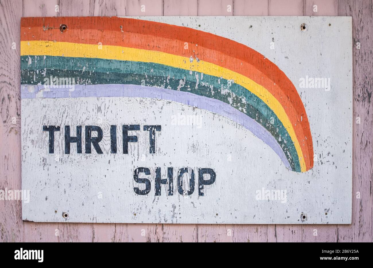 A Conceptual Recession Image Of An Old Sign For A Thrift Shop Stock Photo