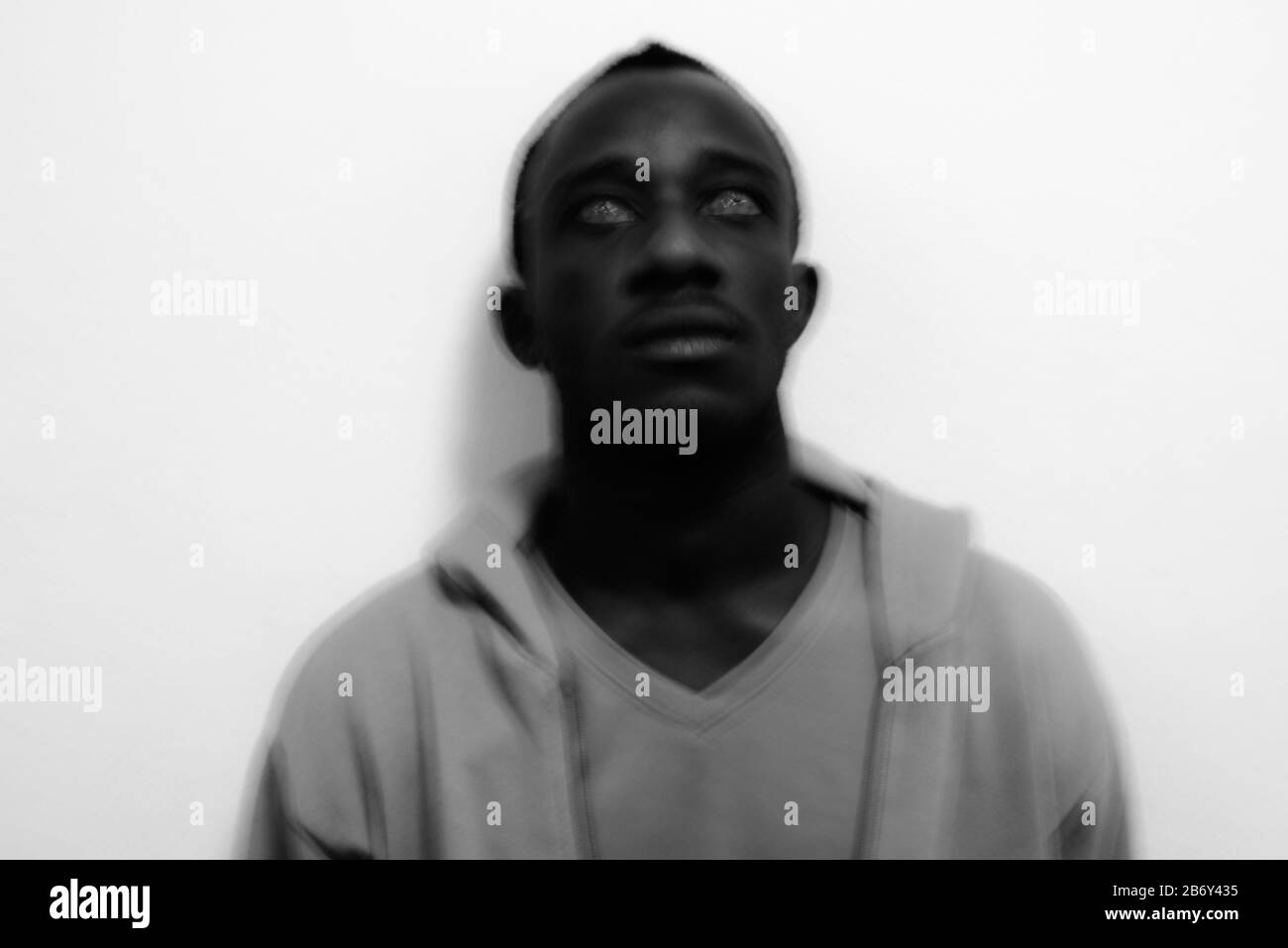 Portrait of young African man against white background Stock Photo Alamy