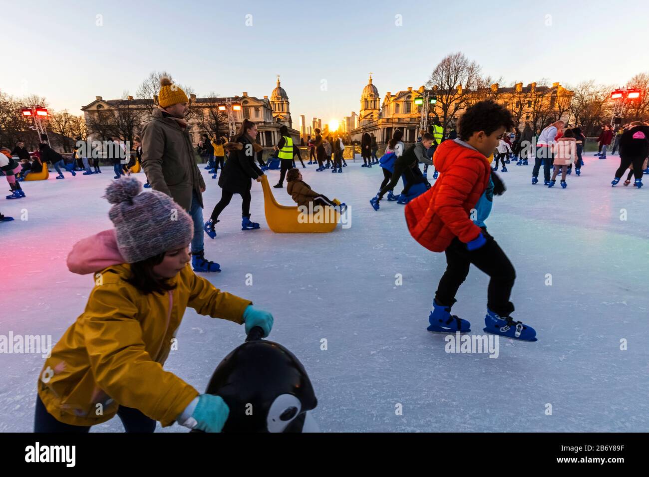 Adults children ice skating at the queens house ice rink hires stock