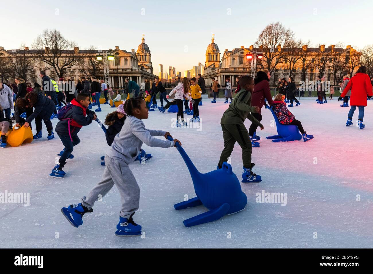 England, London, Greenwich, Adults and Children Ice Skating at The
