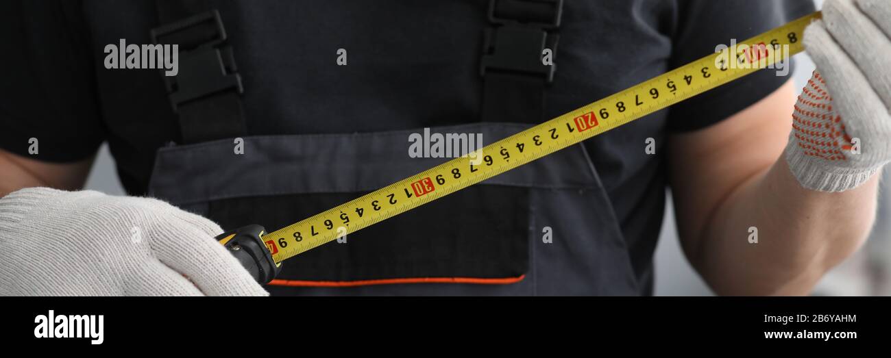 Man holding measuring device Stock Photo