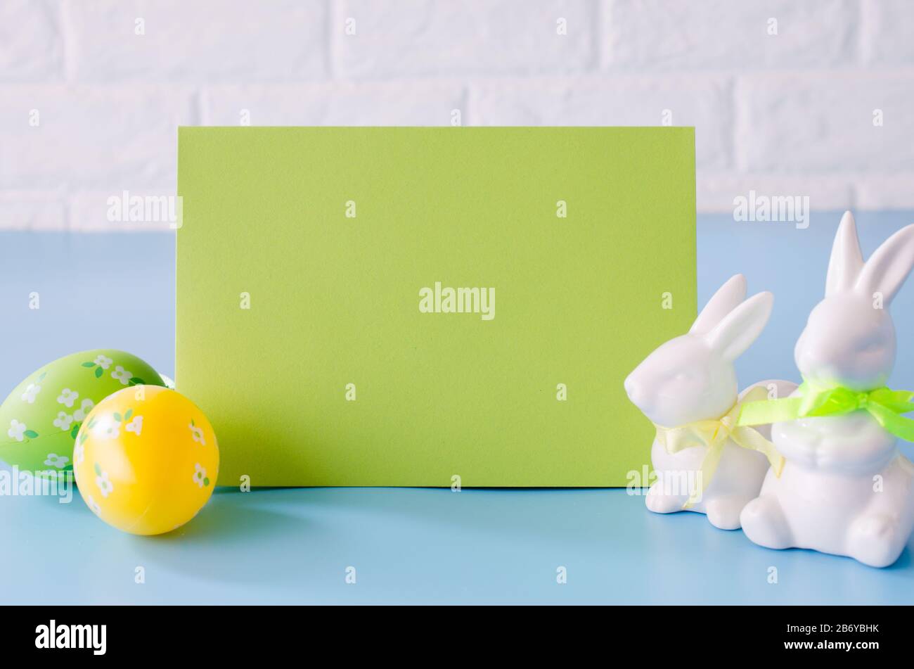 Happy Easter. Empty copyspace easter card. Easter background with decorative white rabbits. Stock Photo
