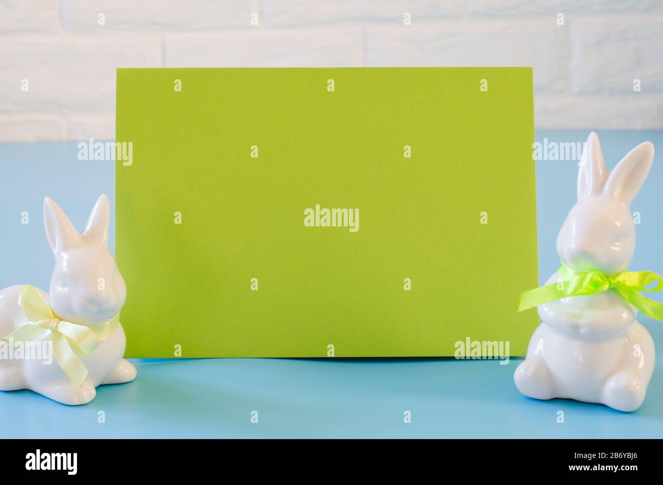 Happy Easter. Empty copyspace easter card. Easter background with decorative white rabbits. Stock Photo