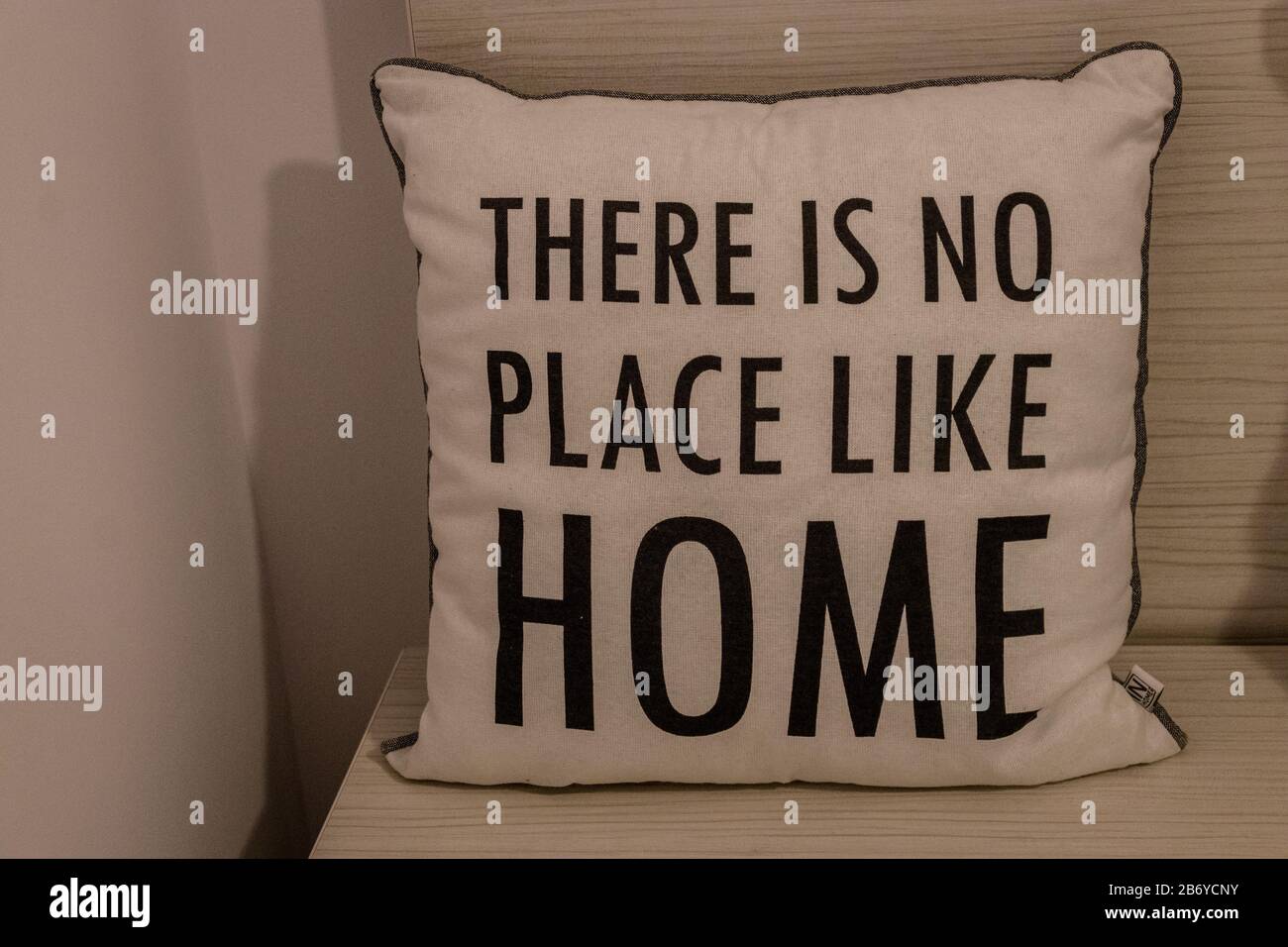 White pillow with 'There is no place like home' message written on it Stock Photo