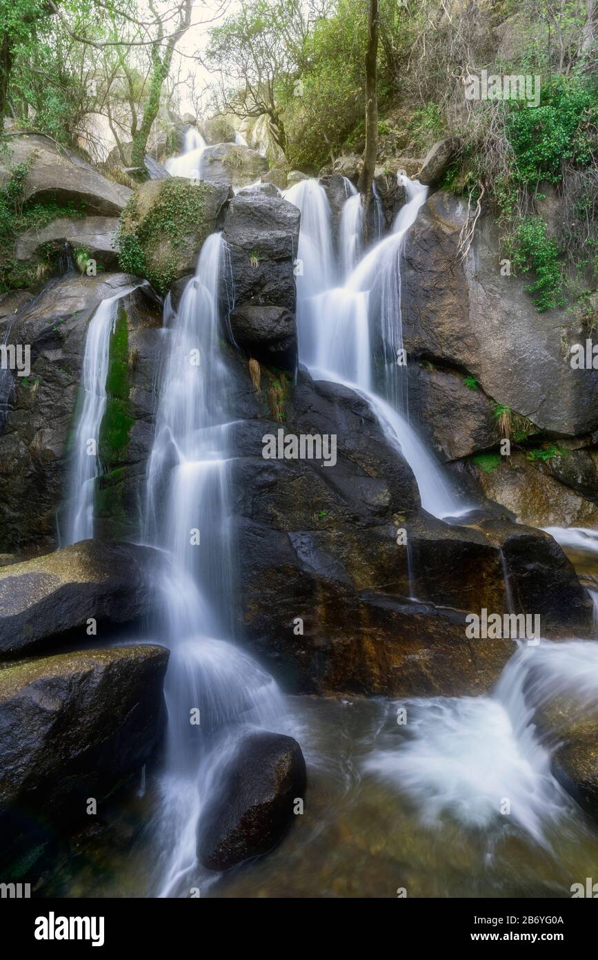 Water falling between rocks forming a silk effect Stock Photo - Alamy