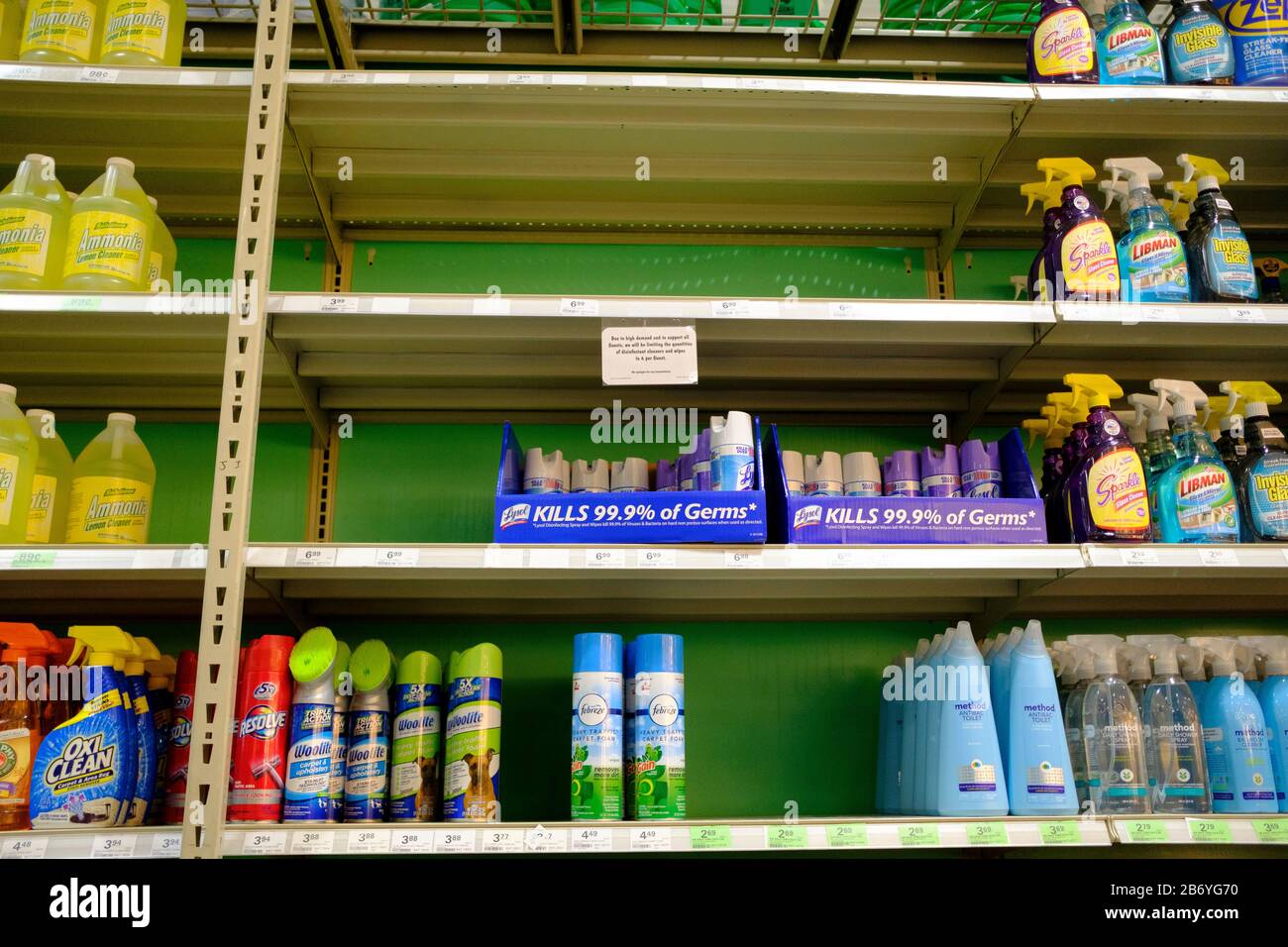 03112020 - Bloomington, Indiana, USA: A shelf of disinfectants is emptied at Menards on the day World Health Organization declared Coronavirus to be a pandemic. Toilet paper, wipes, protective breathing masks, and other items are either sold out at local stores, or are in short supply. Stock Photo