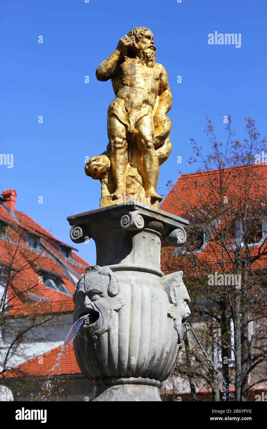 golden neptune fountain in ljubljana Stock Photo