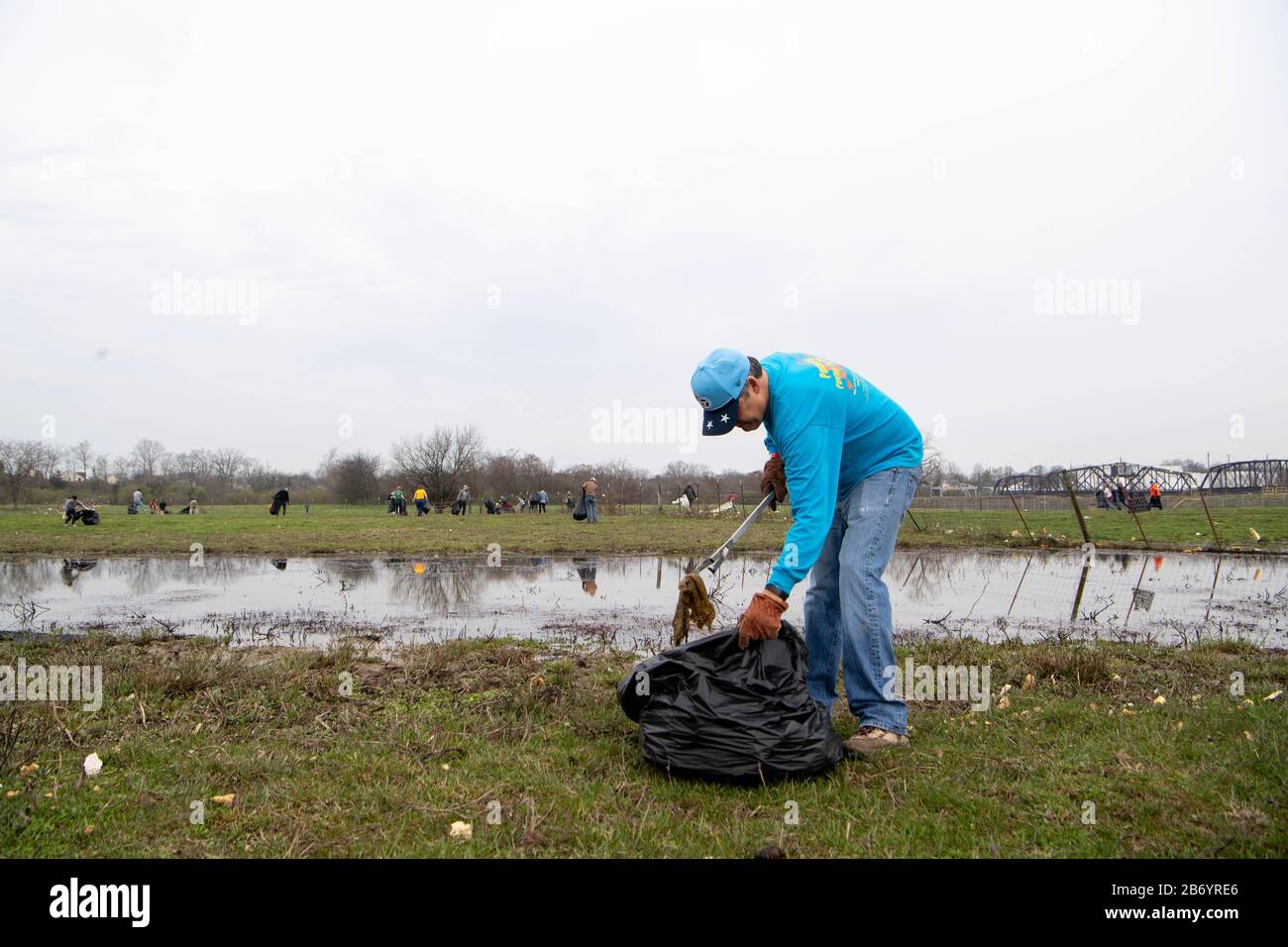 USA. 12th Mar, 2020. Brady Spencer and other volunteers pick up debris from a tornado at TSU's Architectural Research and Education Center Wednesday, March 11, 2020, in Nashville, Tenn. Cp14068 (Photo by Courtney Pedroza/The Tennessean/Imagn/USA Today Network/Sipa USA) Credit: Sipa USA/Alamy Live News Stock Photo